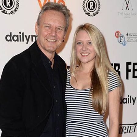 Emily and Anthony posing for a picture